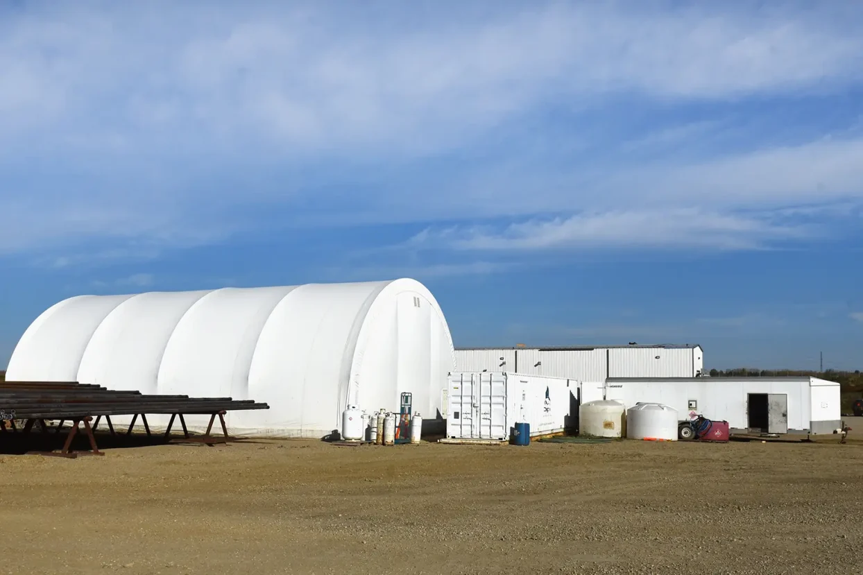 Force Inspection Services White construction buildings in a field